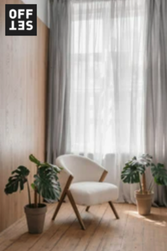 A room with white curtains and a wooden chair.
